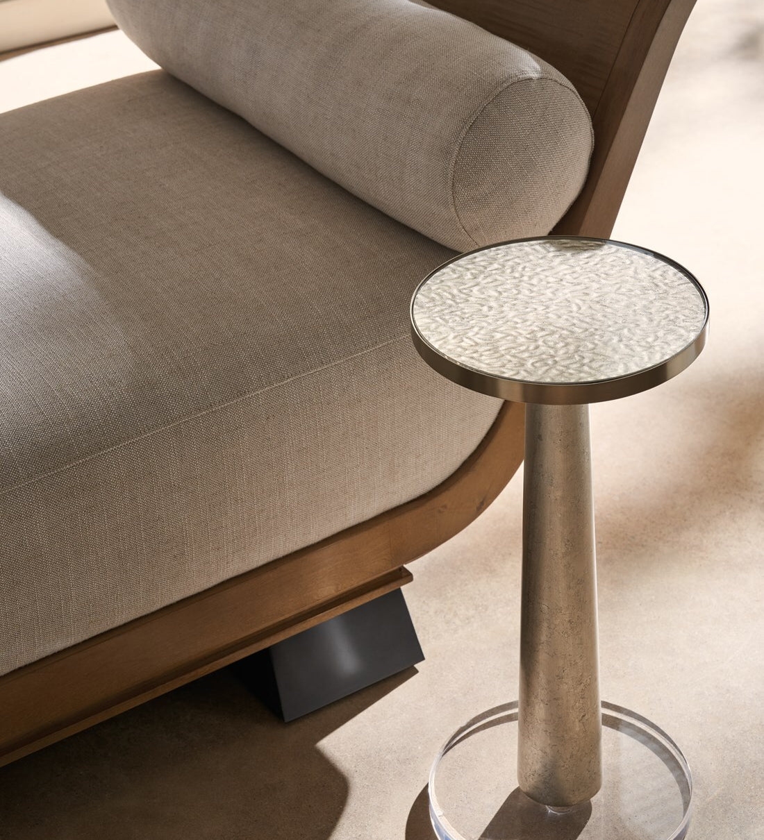 Modern living room with upholstered armchair and small round side table