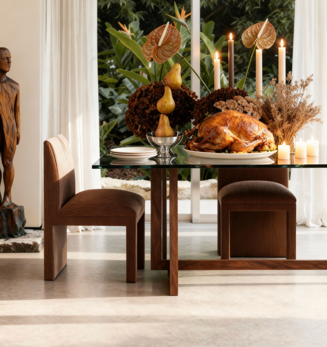 Dining table set with a roasted turkey, candles, and decorative elements in a room with plants and a statue.